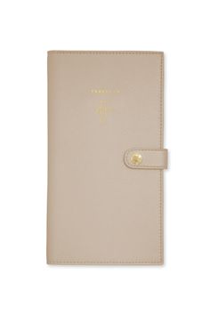 DESCRIPTIONReady, set, adventure! Get ready for your next exciting trip with our perfect taupe travel wallet.Understated and oh so chic, it has two handy sections, one for your passport and one for your travel documents, all closed up perfectly with a golden press stud. Finished with the lovely sentiment 'Let's fly away' to the front for a touch of added travel magic.PRODUCT DETAILSHeight 9 1/16"Width 4 3/4"CARE INSTRUCTIONSKatie Loxton is a brand that’s driven by providing affordable luxury pro Travel Wallet With Interior Card Slots In Beige, Gold Bifold Wallet For Travel, Gold Travel Wallets With Card Slots, Gold Wallets With Card Slots For Travel, Gold Bifold Wallets For Travel, Gold Rfid Blocking Travel Wallets, Gold Travel Wallets With Rfid Blocking, Gold Wallets With Rfid Blocking For Travel, Travel Documents