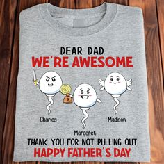 a t - shirt that says, dear dad we're awesome and has three small cartoon characters on it