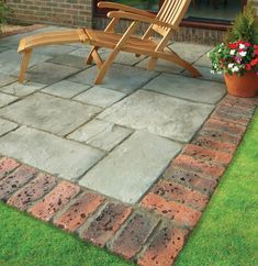 a wooden chair sitting on top of a stone patio