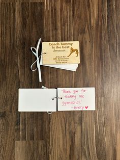 two pieces of luggage tags on a wooden floor