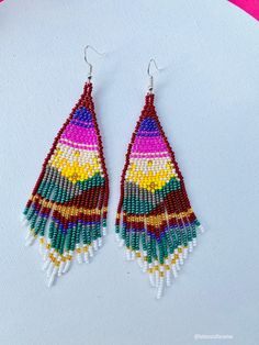 These beautiful beaded earrings are so colorful and perfect for all-day wear. They are definitely the perfect accessory to style up your look and add personality to your outfit. These lovely handmade earrings are made with sterling silver hooks and colorful beads. Each pair of earrings that we sell is authentic and one-of-a-kind! Finds more styles at https://www.etsy.com/shop/LatinxsCulturaViva?ref=simple-shop-header-name&listing_id=990207426&section_id=26730499 Thank you so much for vis Colorful Beaded Teardrop Earrings For Beach, Teardrop Earrings With Colorful Beads For Beach, Teardrop Beach Earrings With Colorful Beads, Colorful Tiny Beads Dangle Earrings, Multicolor Tiny Beads Drop Earrings, Pink Large Bead Dangle Earrings, Colorful Dangle Earrings With Tiny Beads, Pink Dangle Earrings With Large Beads, Adjustable Multicolor Earrings With Large Beads