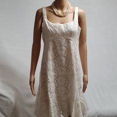 Item Detail: . Nwt .Women Dress/ Eyelet Embroidered Dress . Size 12 . Color Ivory . Sleeveless . Knee Lenght . Raffle Hem . Made In Usa Measurement: ( Garment Laying Flat Approx) . Armpit To Armpit 18" . Shoulder To Hem 37" See Image For More Detail Or Text Me If Any Question Smokepetfree Reasonable Offers Welcome! Summer Cotton Lace Dress With Ruffles, Fitted Mini Dress With Cutwork Hem For Summer, Knee-length Lace Sleeveless Dress For Summer, Summer Garden Party A-line Lace Dress, Sleeveless Summer Mini Dress With Cutwork Hem, Sleeveless Ruffled Lace Summer Dress, Sleeveless Ruffled Lace Dress For Summer, Sleeveless Summer Lace Dress With Ruffles, Sleeveless Daywear Dresses With Cutwork Hem