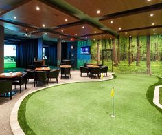 an indoor golf course with tables and chairs