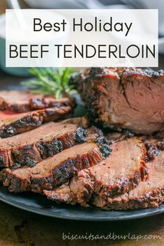 the best holiday beef tendereon recipe on a black plate with rosemary sprigs