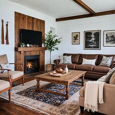 a living room filled with furniture and a fire place