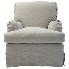 a white chair with buttons on the back and armrests that are not upholstered