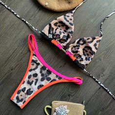 This sexy leopard print bikini is sure to turn heads and make a statement at the beach or poolThe backless halter top adds a touch of flirtiness, while the tie-side bottom allows for a customizable and comfortable fitMade from high-quality and stretchy material, this bikini is designed to hug your curves and create a flattering silhouette. Perfect for sunbathing or swimming, this bikini is a must-have for any fashion-forward beach-goerMaterial: NylonColors: ZY72001, ZY72002, ZY72003, ZY72004, ZY Leopard Print Swimsuit, Blazers Shoes, Backless Halter Top, Backless Swimsuit, Off Shoulder Sweater, Print Swimsuit, Swimsuit Fashion, Romper Pants, New Arrival Dress