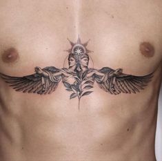 a woman's chest with two birds and leaves on the side, in front of her