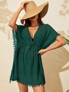 The dark green cover up features a deep V-neck, a plain pattern, and short sleeves, designed with drawstring and pom pom detailing for styling options. Non-stretch woven polyester fabric ensures easy wearability, and care instructions include either machine washing or professional dry cleaning. The sheer construction finishes off the look. Size Belt Length Bust Length Shoulder Sleeve Length S 78.7 47.2 33.5/31.5 32.3 12.2 M 78.7 48.8 33.9/31.9 33.1 12.5 L 78.7 51.2 34.4/32.5 34.3 13 XL 78.7 53.5 Cover Up Outfits, Beach Outfits Women Dresses, Tulle Skirt Black, Beautiful Casual Dresses, Swimming Beach, Beachwear Fashion, Women's Cover Up, Cover Ups, Diy Couture