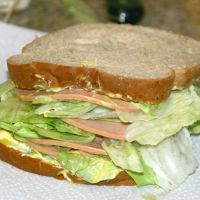 a sandwich with lettuce and meat on it