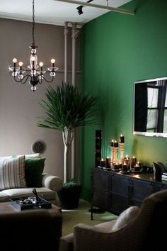 a living room filled with furniture and a chandelier