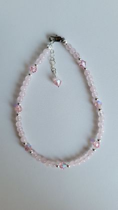 This anklet brings together Sterling Silver, matching Czech Crystal and Rose Quartz Gemstones. The Rose Quartz gemstone is a light pink color and is known as a romance stone and attracts love. It also helps to lower stress and tension in the heart. It clears out anger, jealousy and resentment of others. It clears the heart of any negative emotions allowing it to heal and is thought to aid in enhancing self-esteem and self- acceptance. The anklet has a 1" extension with a beaded drop making it ad Elegant Adjustable Pink Anklets, Elegant Pink Adjustable Anklets, Light Pink Color, Czech Crystal, Rose Quartz Gemstone, Quartz Rose, Anklet Jewelry, Body Jewellery, Body Jewelry