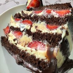 a piece of chocolate cake with strawberries on top