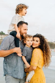 a man, woman and child posing for a photo