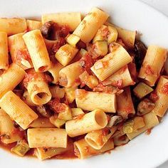 a white bowl filled with pasta and sauce