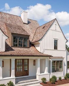 the instagram page on instagram com shows an image of a white house with brown shingles