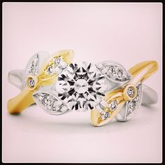 It s two-tone Tuesday! Check out this two-tone white and yellow gold mystic! Flower Shaped Brilliant Cut Jewelry For Wedding And Anniversary, Flower Shaped Diamond Ring With Center Stone, Diamond Flower Ring With Center Stone For Promise, Diamond Flower Ring For Wedding Anniversary, Diamond Flower Ring For Wedding And Anniversary, Heirloom Flower Ring With Single Cut Diamonds For Anniversary, Heirloom Diamond Flower Ring For Anniversary, Flower Shaped Wedding Ring With Accent Stones, Dazzling Flower Ring With Center Stone For Anniversary