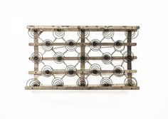 a wooden rack with metal circles and chains on it's sides against a white background