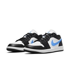 The Air Jordan 1 Low "Black University Blue" is a low-top women's sneaker that features an all-leather upper. The white base is contrasted by black overlays, a signature Swoosh, stitched Wings logo on the heel, and a Jumpman icon embroidered on the nylon tongue in University Blue. It is built on a sturdy rubber cupsole with encapsulated Air cushioning in the heel. Air Jordan 1 Low Unc, Jordan 1 Low Unc, Air Jordan 1 Low Black, Unc University, Designs Clothes, Wmns Air Jordan 1, Jordan Model, Jumpman Logo, Womens Air Jordans