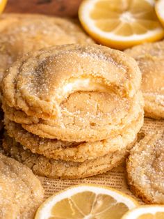 cookies and lemons are stacked on top of each other with powdered sugar in the middle