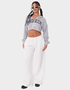 These Wide-Leg, Low-Rise Sweatpants Are The Ultimate Choice For A Cozy And Effortless Look. Perfect For Lounging Or Running Errands, Their Comfortable And Relaxed Fit Ensures You'll Feel Stylish And Comfortable All Day Long. Sweatpants. Low Rise Waist. Adjustable Waistband. Wide Leg. Model Wears Size S. Model Height Is 5'7. Item Care: Wash With Similar Colors. 50% Cotton, 50% Polyester. | Edikted Kamari Low Rise Wide Sweatpants Low Rise Joggers, White Cropped Pants For Fall, White Cropped Bottoms For Loungewear, Wide Sweatpants, Low Rise Sweatpants, Long Sweatpants, White Sweatpants, Leg Model, Grey Sweatpants