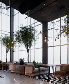 an empty restaurant with large windows and plants in the center, along with checkered flooring