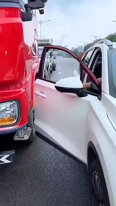 two cars parked next to each other in a parking lot