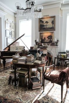 a living room filled with furniture and a piano