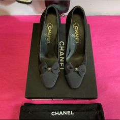 Stop The Show In These Classic Chanel Black Classic Cap Toe Pumps. It Doesn’t Get More Timeless Than These! Almost Perfect Condition Outside Of Being Worn Once. Black Suede With A Grosgrain Cap Toe With A Bow And Gold Chanel Logo Excellent Condition! The Uppers On Both Shoes Are Perfect And Look Like New. The Leather Foot-Beds Are Pristine. The Bottom Soles Have Some Wear. Black Suede Heel, 4'' 'Cc' Bow Detail Grosgrain Cap-Toe Leather Lining And Sole Chanel Bow Pumps, Gold Chanel Logo, Classic Chanel, Bow Pumps, Gold Chanel, Chanel Logo, Black Suede Heels, Almost Perfect, Chanel Black