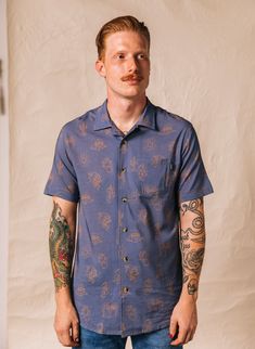 This men’s collared button-down shirt featuring burritos, cacti, margaritas, and our other favorite southwestern foods. Whether you’re buttoning it to the top or dressing it down with a graphic tee, you’ll stay comfy and cool all day long in this super-soft cotton blend shirt. Features: Super Comfy, Well Made Cotton Blend Unique All-Over Print Design Vacation Shirt Collar Tortoise Buttons Available in Chambray Blue Love the Fit? Then please hang dry! Do not put in the dryer. Food Socks, Food Shirt, Comfortable Loungewear, Eco Friendly Clothing, Innovative Fashion, Mens Button Up, Fleece Sweater, Tailored Suits, Organic Fabrics