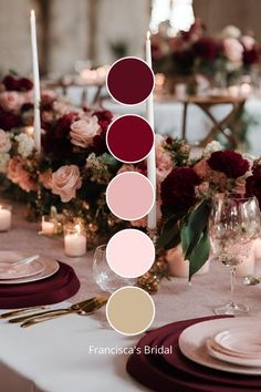 the table is set with candles, plates and flowers in shades of red, pink, beige and white