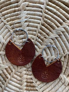 Thick brown hand stamped leather circle earrings. Lotus flower for a touch of feminine Leather Boho Earrings, Handmade Leather Everyday Earrings, Leather Earrings Diy, Elegant Round Leather Jewelry, Circle Leather Earrings, Elegant Brown Leather Earrings