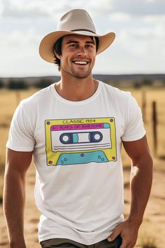 a man wearing a white t - shirt with a cassette tape on it