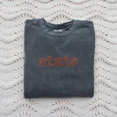 How cute are these custom outlined embroidered sweatshirts?! These hand made pullovers are made to order and are perfect for gameday, a new mom or bride, teacher appreciation, or a simple birthday gift. Customize with any combination of characters or words up to 15 letters with 1-4 thread colors. Examples include, abbreviations, a name/nickname, a special date, a state, school, or a fun simple phrase. - Each sweatshirt is made to order! Because of this, the process of obtaining materials, and orders ahead of yours, it can take up to two months for us to ship out your sweatshirt. Thank you for your patience! - No refunds/exchanges - Make sure all spelling is correct! - Sweatshirts are true to size and do not usually run big. If you like a baggier sweatshirt, consider going up a size! - Comf Sporty Cotton Sweatshirt With Custom Embroidery, Game Day Cotton Sweatshirt With Embroidered Logo, Cotton Sweatshirt With Embroidered Logo For Game Day, Varsity Cotton Sweatshirt With Embroidery, Crew Cotton Sweatshirt With Machine Embroidery, Cotton Crew Sweatshirt With Machine Embroidery, Embroidered Cotton Sweatshirt For College, Gray Embroidered Text Sweatshirt For Fall, Varsity Cotton Sweatshirt With Custom Embroidery