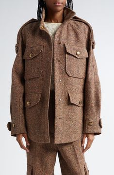 Oversized proportions define this nubby tweed field jacket tailored with double-layer epaulets draping over the roomy raglan sleeves. Antiqued brass sunray buttons accent the utility pockets and adjustable belted cuffs. 30" length (size Medium) Hidden magnetic-snap closure Stand collar Adjustable button-tab cuffs Chest button-flap patch pockets; front button-flap pockets Button epaulets Lined Dry clean 30% wool, 25% recycled polyester, 25% polyester, 15% silk, 5% other fibers Made in Portugal De Fall Tweed Outerwear With Flap Pockets, Tweed Outerwear With Flap Pockets For Work, Fall Tweed Jacket With Patch Pockets, Utility Pockets, Field Jacket, Tweed Jacket, Flap Pocket, Raglan Sleeve, Stand Collar