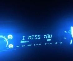 a digital clock with the words i miss you projected on it's display screen