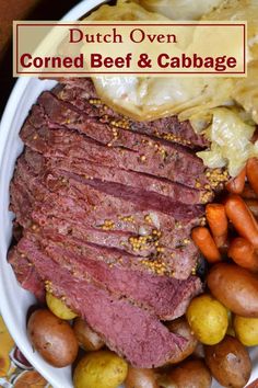 corned beef and cabbage on a white plate with potatoes, carrots and broccoli