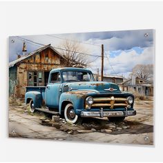 an old rusty blue truck parked in front of a wooden building on the side of a road