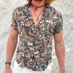 About this shirt: The ultimate buta butterfly print for warm weather, this lightweight button-down is a unique evolution to a vacation classic. It's made in smooth, soft rayon, with a camp collar and shirttail hem. It's perfect for social gatherings and summer festivals. Be sure to turn heads, embody stating who you are as a man of earth. Sizing:  Slim fit If unsure between sizes: Size up for a leisurely, yet stylish fit; Keep size down for an athletic, slim fit Product Details:  Color: Forest G Butterfly Handmade, Green Gift, Summer Festivals, Boho Shirt, Boho Shirts, Social Gathering, Green Gifts, Summer Festival, Handmade Boho