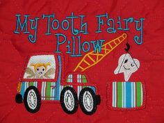 a red shirt with a cartoon truck and dog on it's back that says, my tooth fairy pillow