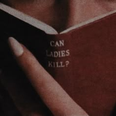 a woman reading a book that says can ladies kill?