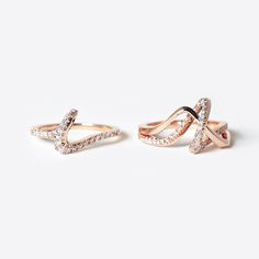 The Sera Ring features a single, delicate knot that is formed by a simple twisting line. The Sera Ring is a companion to the Amare Ring (which is the perfect engagement ring to the Sera wedding band). Both rings stand beautifully on their own, but together they become an elegant, single statement. Dimensions: 0.9" x 1" x 0.27" Available In: Platinum, Platinum with diamonds, 18K White Gold, 18K White Gold with diamonds, 18K Rose Gold, 18K Rose Gold with diamonds, 18K Yellow Gold, 18K Yellow Gold Rings Stand, Unique Wedding Bands For Women, Jewelry Roll Travel, Wedding Bands For Women, The Perfect Engagement Ring, Jewelry Roll, Unique Wedding Bands, Local Jewelry, Perfect Engagement Ring