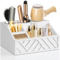 an assortment of cosmetics and makeup brushes in a white holder on a white table top