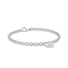 The heart-shaped charm on this 14k white gold bracelet bespeaks romantic love and classic elegance. This charm bracelet looks just as chic worn solo as it does layered with other bracelets. Classic Sterling Silver Bracelet With Charms, Classic White Gold Jewelry With Heart Charm, Classic White Gold Heart Bracelets, White Gold Heart Bracelet With Charm For Anniversary, White Gold Heart Charm Bracelet For Anniversary, Classic Heart Shaped White Gold Bracelet, Elegant White Gold Charm Bracelet For Valentine's Day, Elegant Heart Bracelet With Charms, Elegant Everyday Bracelets With Heart Pendant