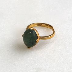 A stunning and large 13mm all natural green-blue moss aquamarine with a very high dome is prong set into a 22k gold over sterling vermeil setting. This stone absolutely glows from every single angle. The size is fully adjustable on the very comfortable band. An absolute one and only fine gemstone ring. Gold Oval Emerald Ring For Everyday Wear, Gold Emerald Ring With Natural Stones For Anniversary, Gold Emerald Cabochon Ring Gift, Gold Emerald Ring With Large Oval Stone, Elegant Gold Emerald Ring With Natural Stones, Elegant Gold Emerald Ring With Large Stone, Gold Emerald Cabochon Ring For May Birthstone, Gold Domed Sapphire Ring Gift, Moss Aquamarine