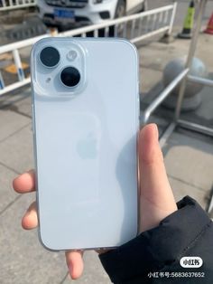 someone holding an iphone in their hand with the camera on it's left side