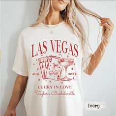 a woman wearing a las vegas lucky in love t - shirt with an image of a glass of wine