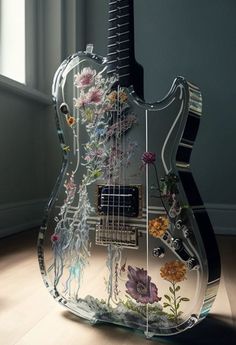 an electric guitar is decorated with flowers and other things on it's back end