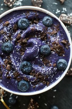 a bowl filled with blueberries and chocolate chips