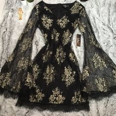 Lulus Black And Gold Lace Flounce Sleeve Dress. Sheer Long Sleeves. Lined. New With Tags Size Small Black And Gold Dress Short, Black And Gold Ball Gown, Black Masquerade Dress, Black Bohemian Dress, Black And Gold Outfit, Gold Dress Short, Masquerade Ball Gowns, Flounce Sleeve Dress, Gold Lace Dresses